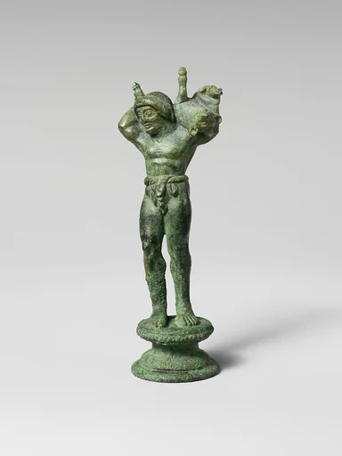 Bronze statuette of a youth carrying a pig