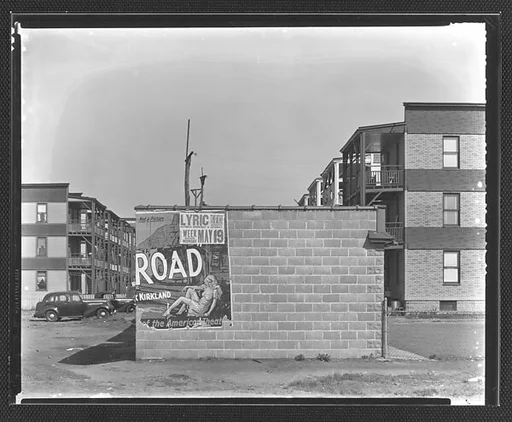 [Movie Poster for "Tobacco Road" on Brick Wall in Front of Tenements, Bridgeport, Connecticut]