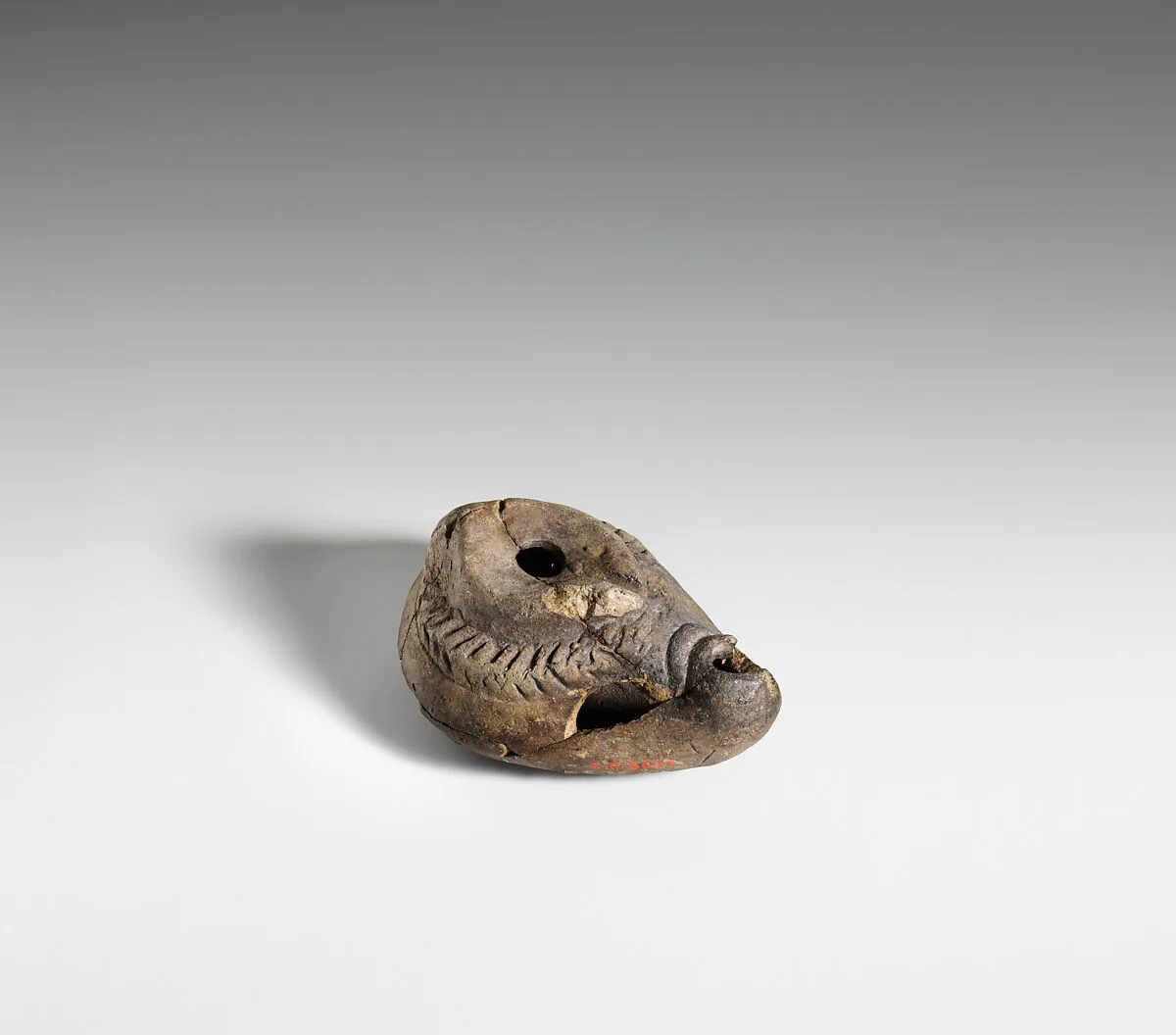 Terracotta oil lamp — Unknown