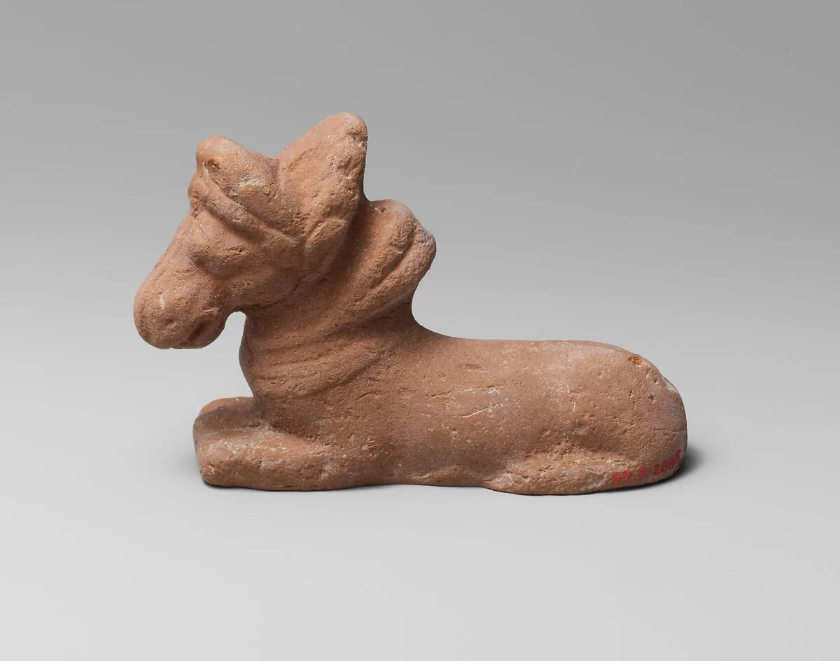 Terracotta figure of a kneeling horse — Unknown