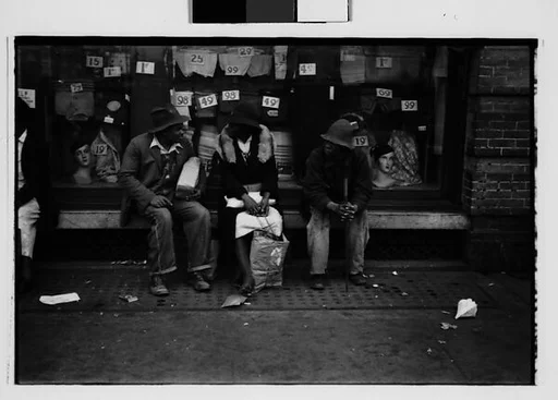 [Two 35mm Film Frames: Two Men and a Woman Seated Outside Clothing Store, Woman Seated in Truck Cab, Georgia]