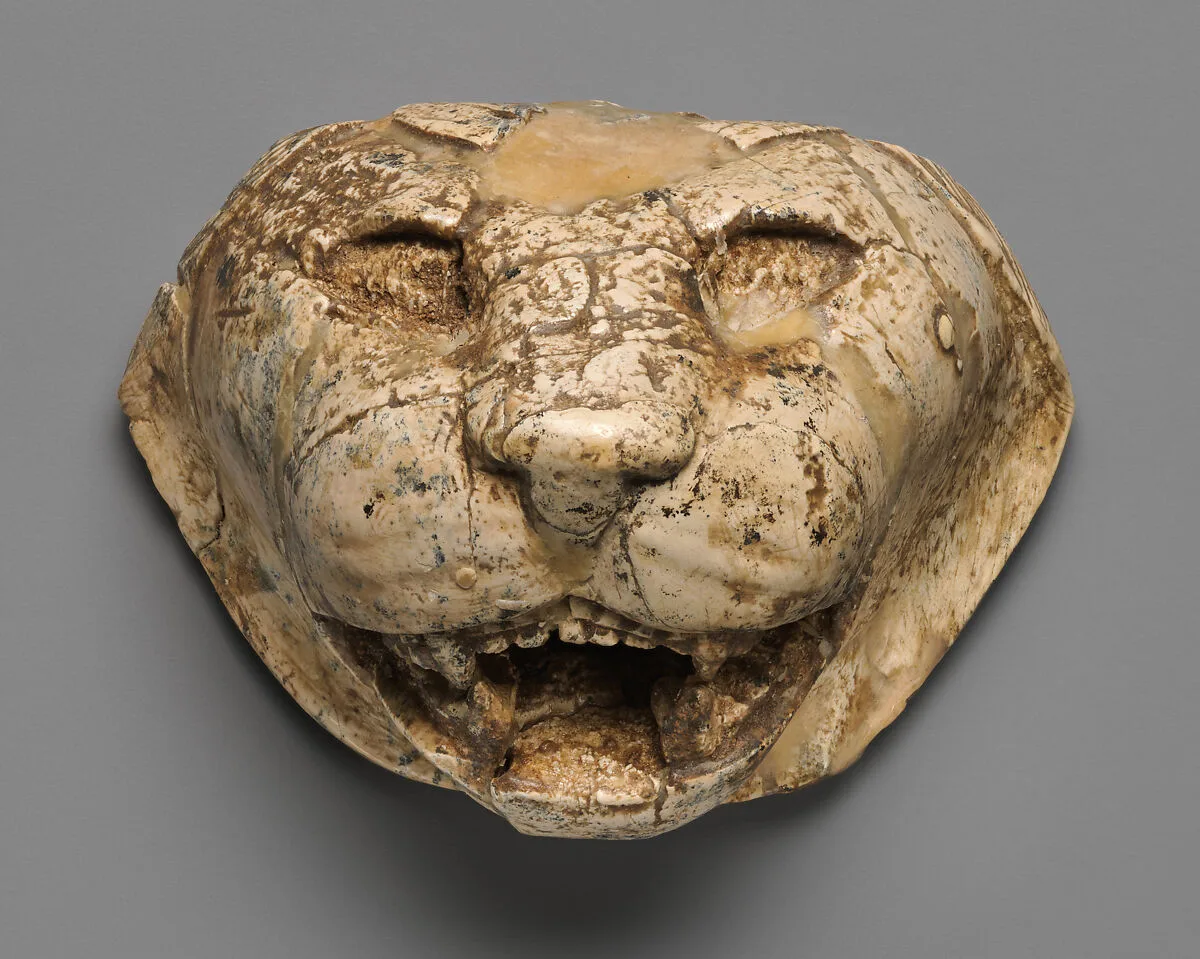 Lion's head carved in the round — Unknown