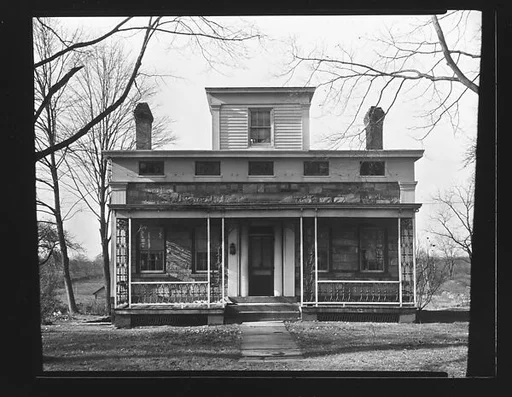[Greek Revival House with Brick Porch and Cast-Iron Railings]