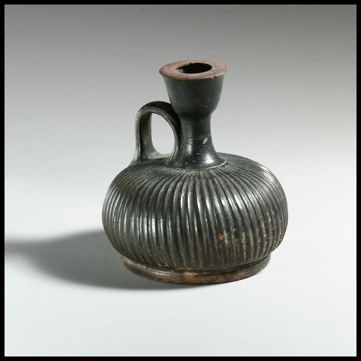 Terracotta squat lekythos (oil flask) — Unknown
