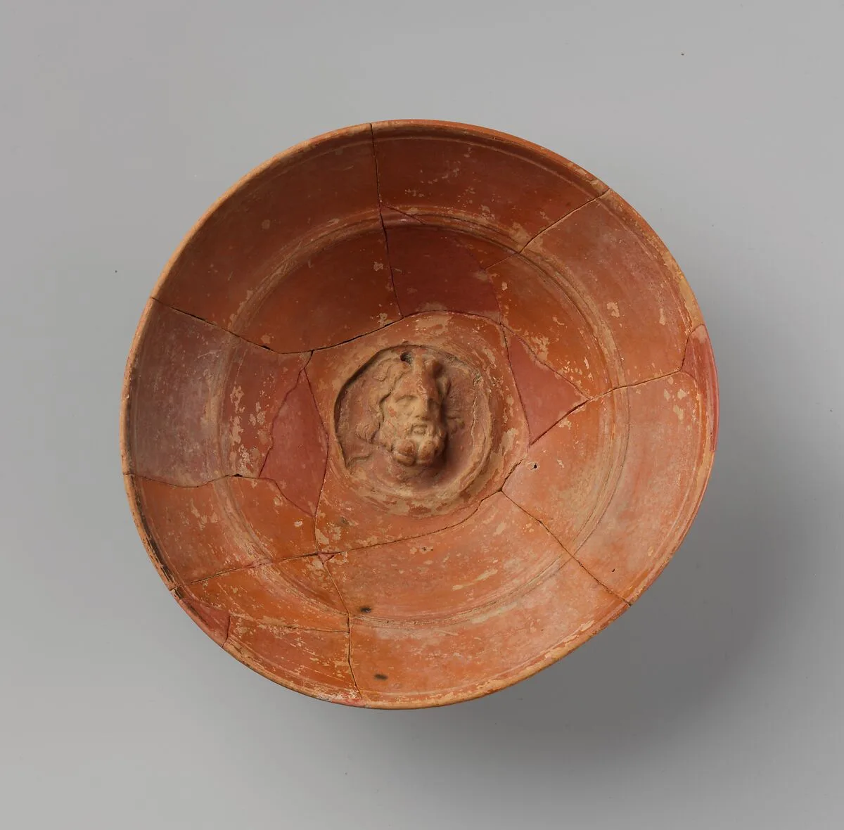 Terracotta emblem bowl with head of Zeus or Sarapis — Unknown