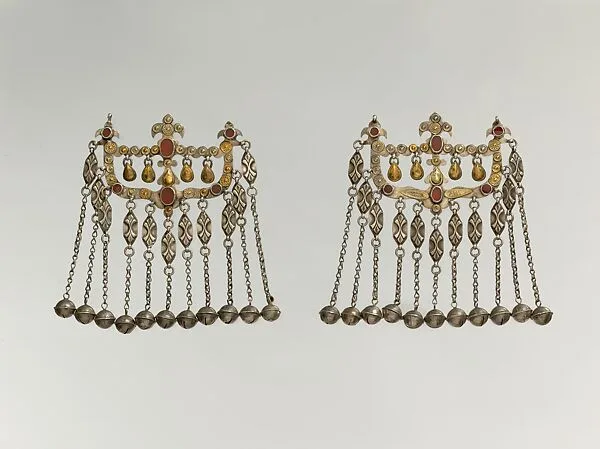 Dorsal Headdress Ornament, One of a Pair — Unknown