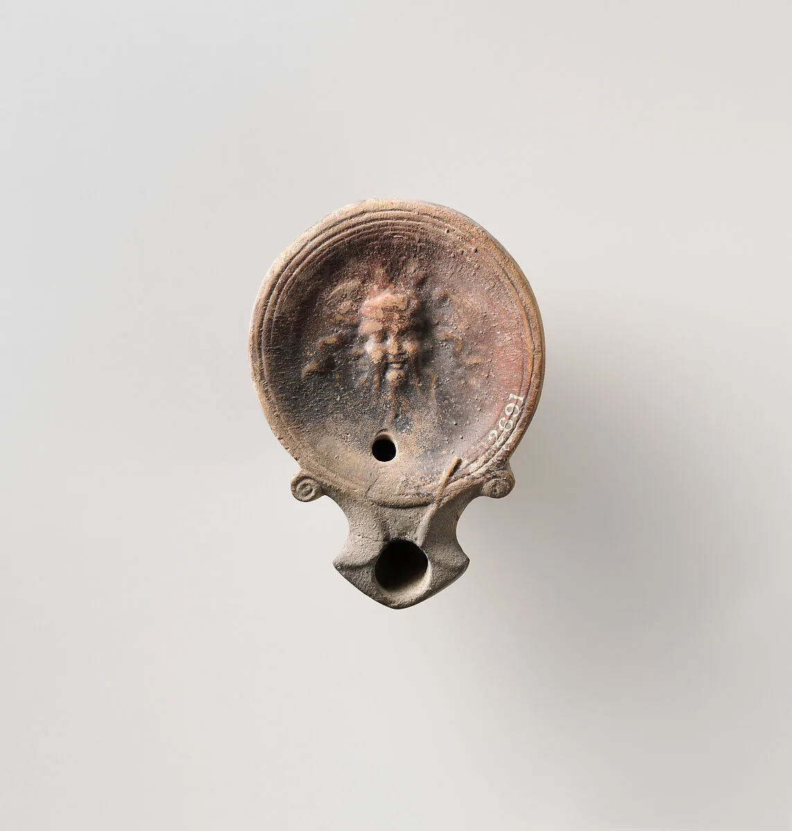 Terracotta oil lamp — Unknown