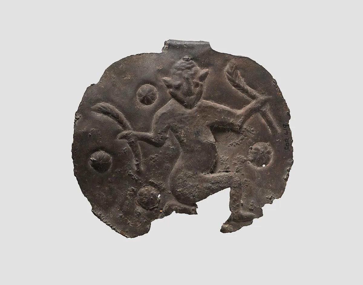 Pendant with a kneeling male — Unknown