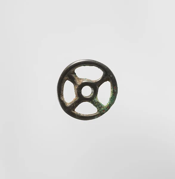 Four-Spoked Votive Wheel — Unknown