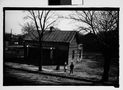 [Wooden House with Children in Yard, From Moving Train, Savannah, Georgia]