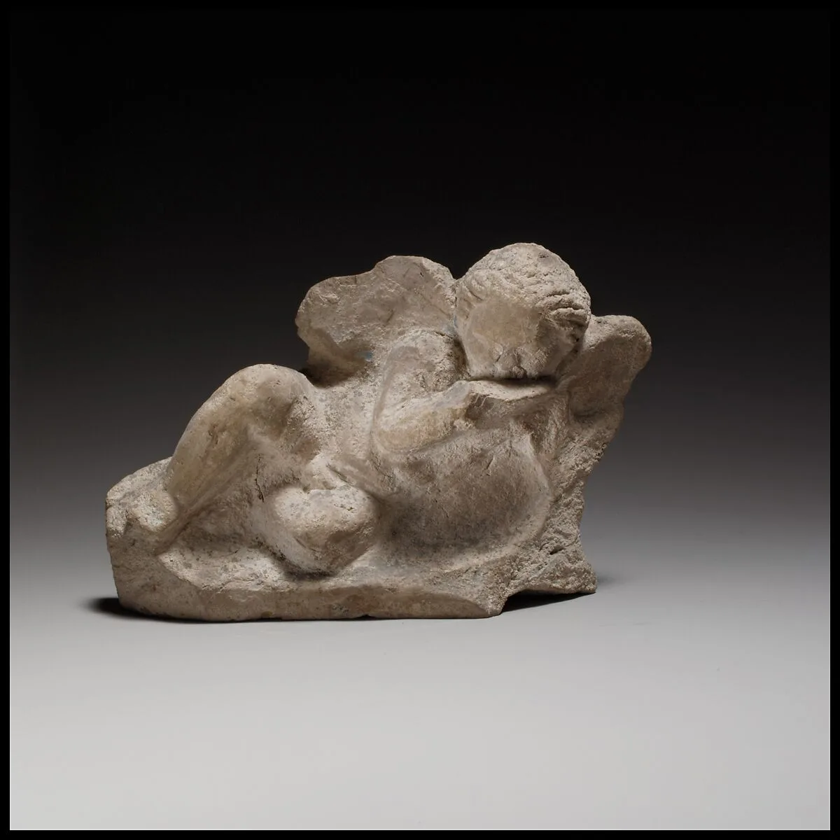 Terracotta statuette of Eros banqueting — Unknown