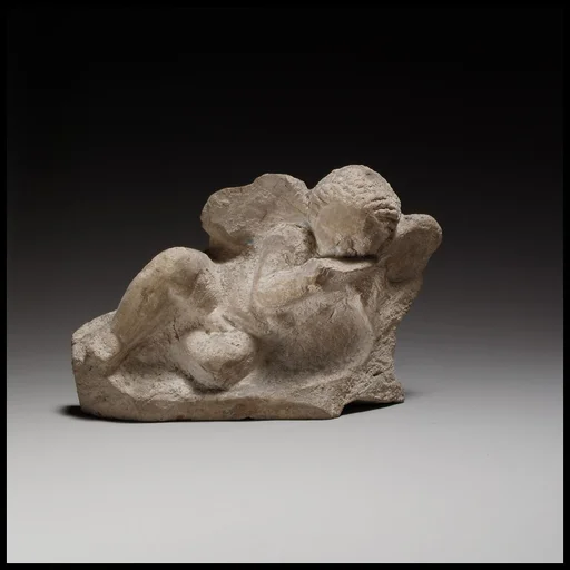 Terracotta statuette of Eros banqueting