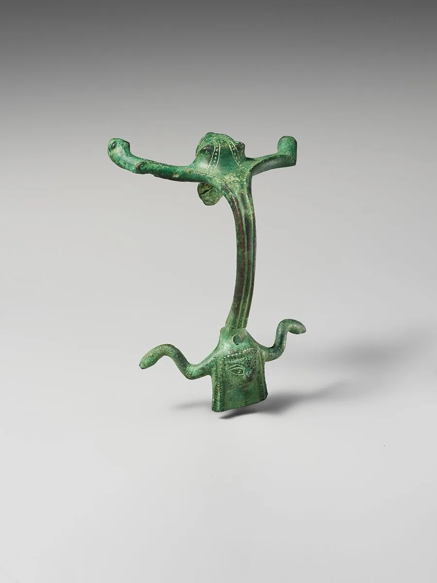 Bronze oinochoe (jug) handle with lion's head and female protome — Unknown