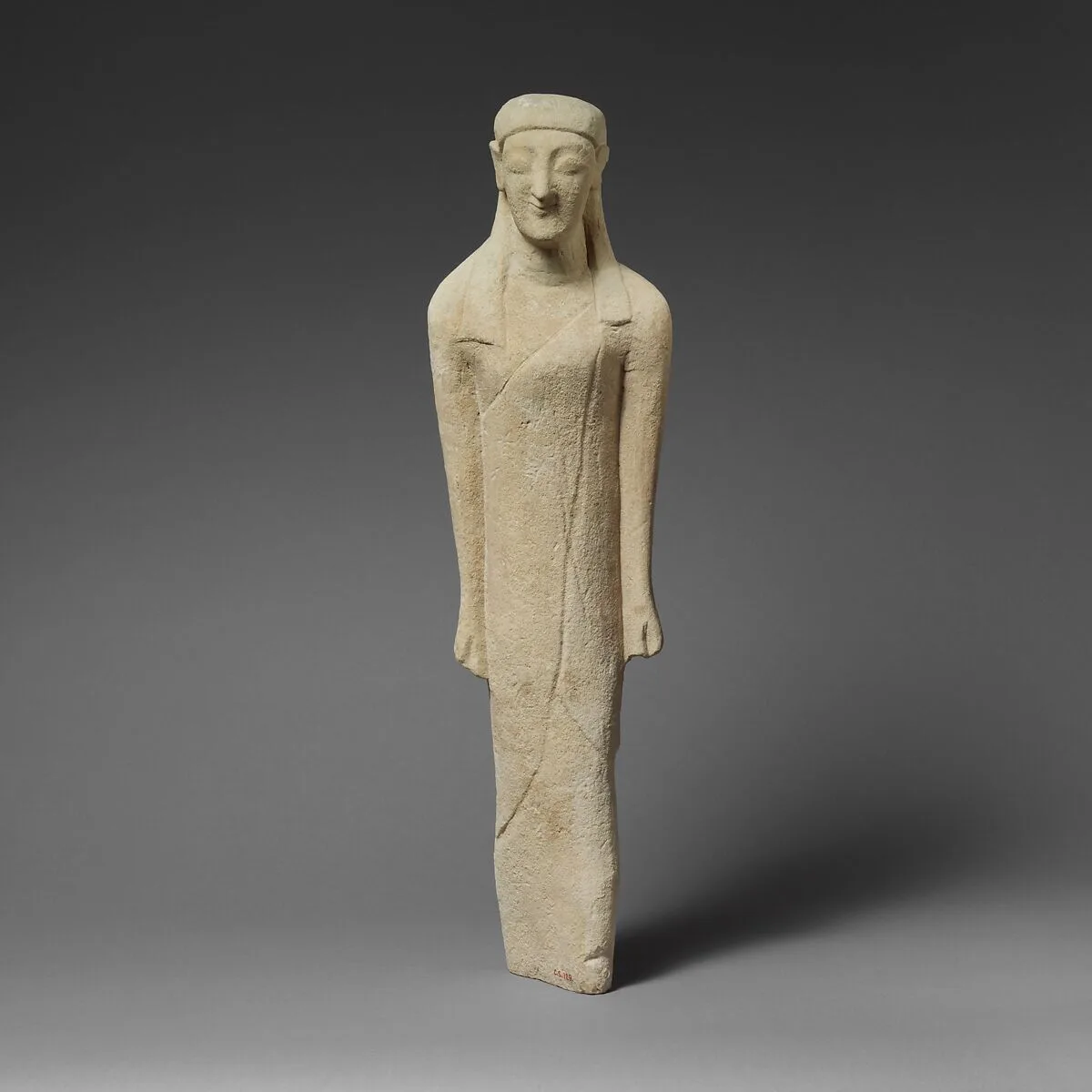 Limestone statuette of a beardless male votary in Greek dress — Unknown