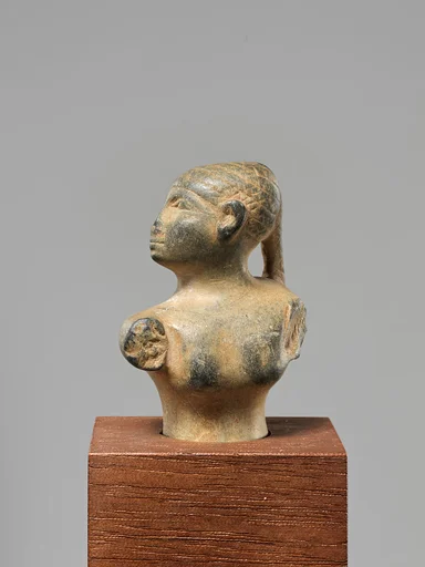 Statuette of a female figure with a braid