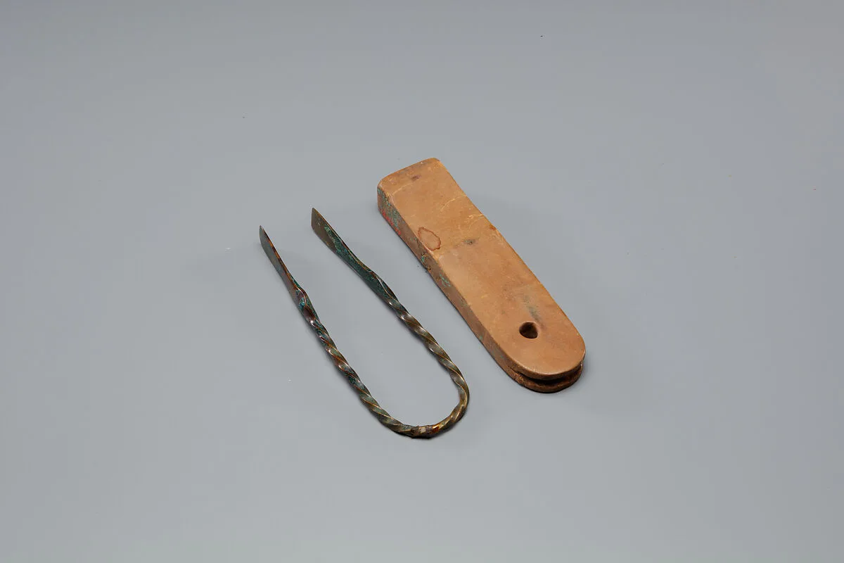 Tweezers Mounted on a Wood Block — Unknown