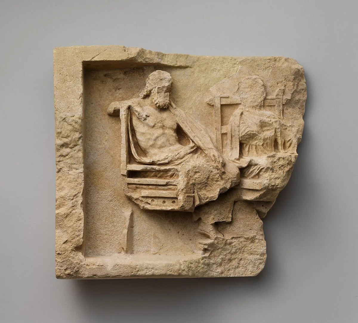 Fragment of a limestone relief with enthroned couple — Unknown