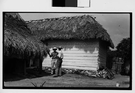 [Farmers in Front of Shanties, Cuba]