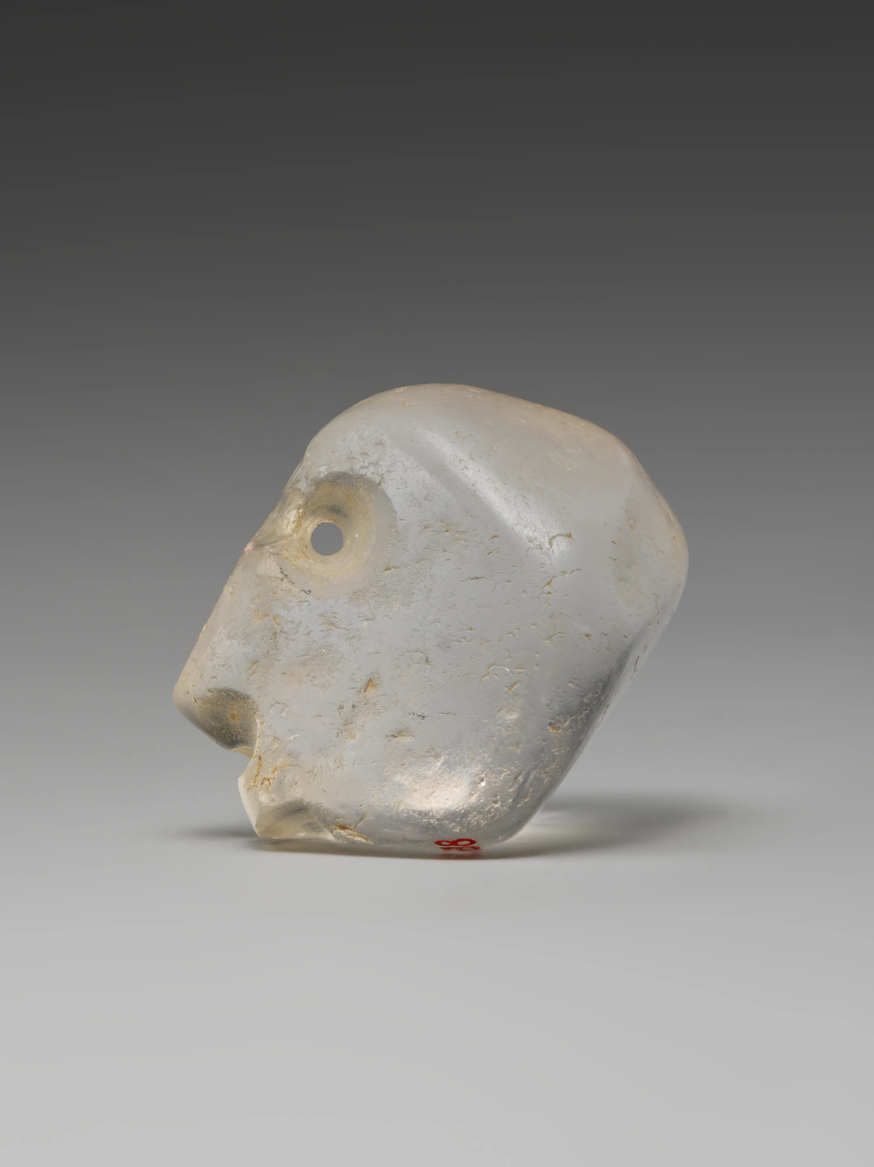 Head amulet (?) — Unknown