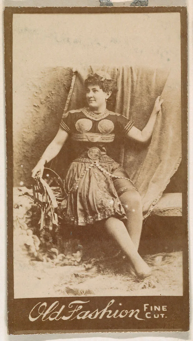 Actress holding studio curtain, from the Actresses series (N664) promoting Old Fashion Fine Cut Tobacco — Unknown