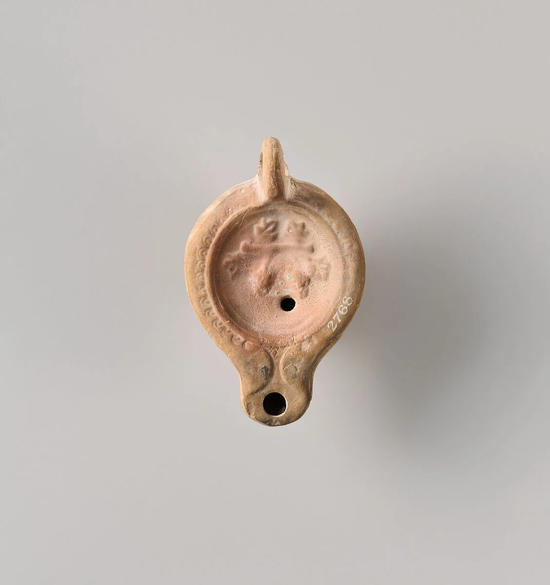 Terracotta oil lamp — Unknown