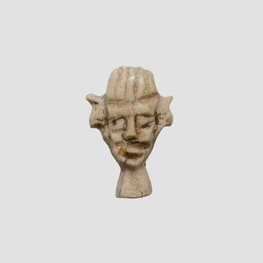 Amulet in the form of a face