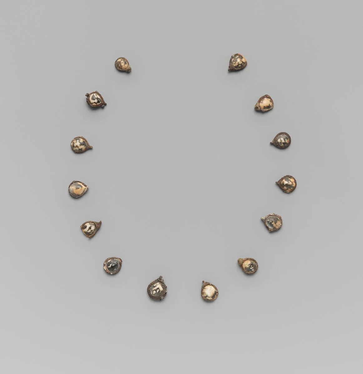 Fourteen pendants for a necklace — Unknown