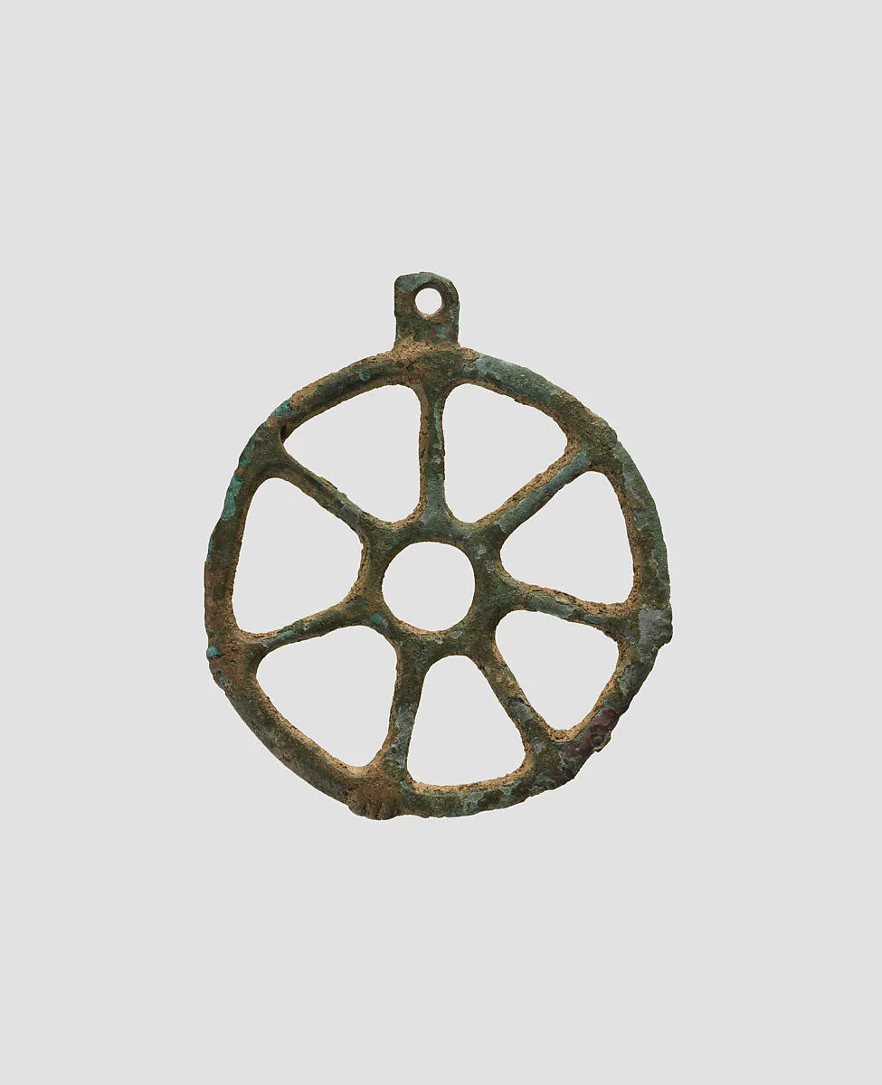 Wheel-shaped pendant — Unknown