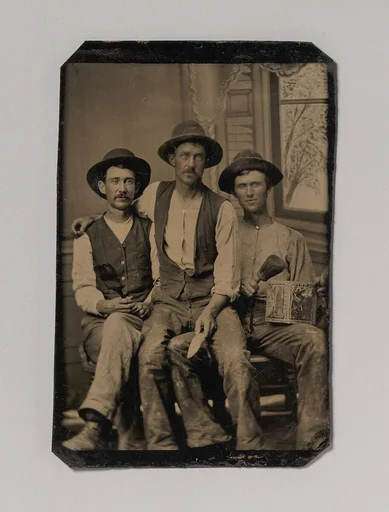 [Three Painters, with Brushes and a Can of Paint, in Front of a Painted Window Backdrop]