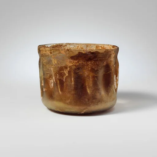 Glass cup with indented sides