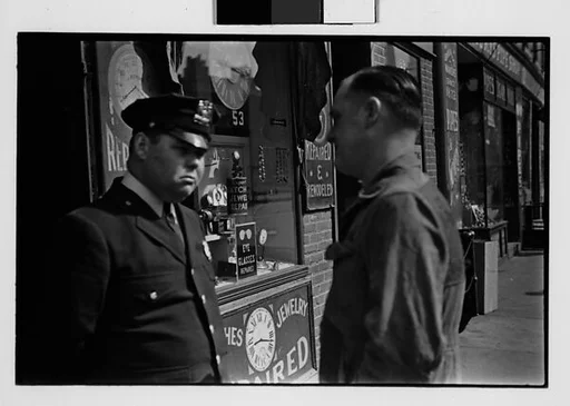 [Three 35mm Film Frames: Man and Policeman in Conversation Outside Watch Repair Shop, Partial View of Man on Street Looking at Camera, Policeman on Street Outside Watch Repair Shop, New York City]