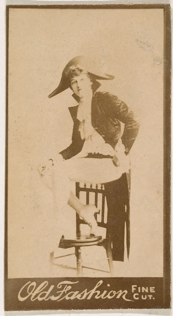 Seated actress wearing military-inspired costume, from the Actresses series (N664) promoting Old Fashion Fine Cut Tobacco — Unknown