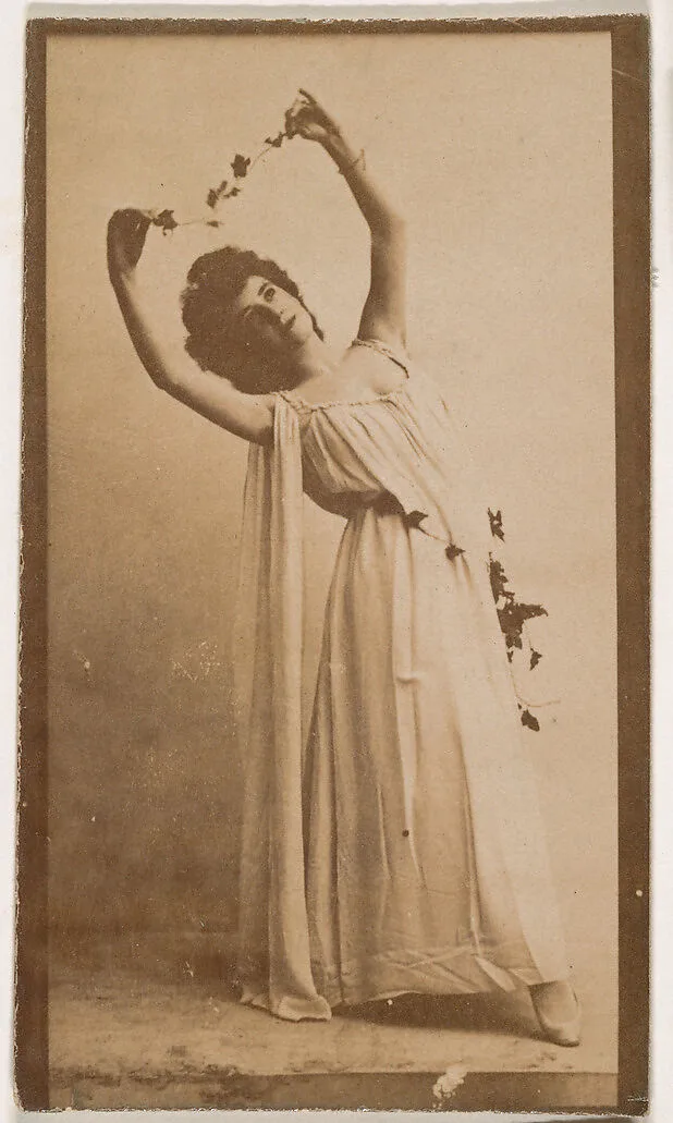 Actress holding vine above head, from the Actresses series (N664) promoting Old Fashion Fine Cut Tobacco — Unknown
