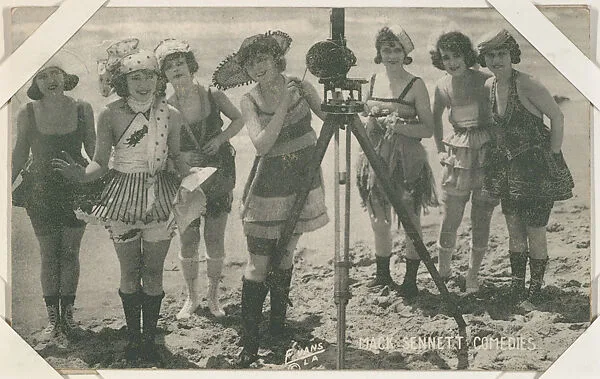 Bathing beauties posed with movie camera from Mack Sennett Comedies Arcade series (W423) — Unknown