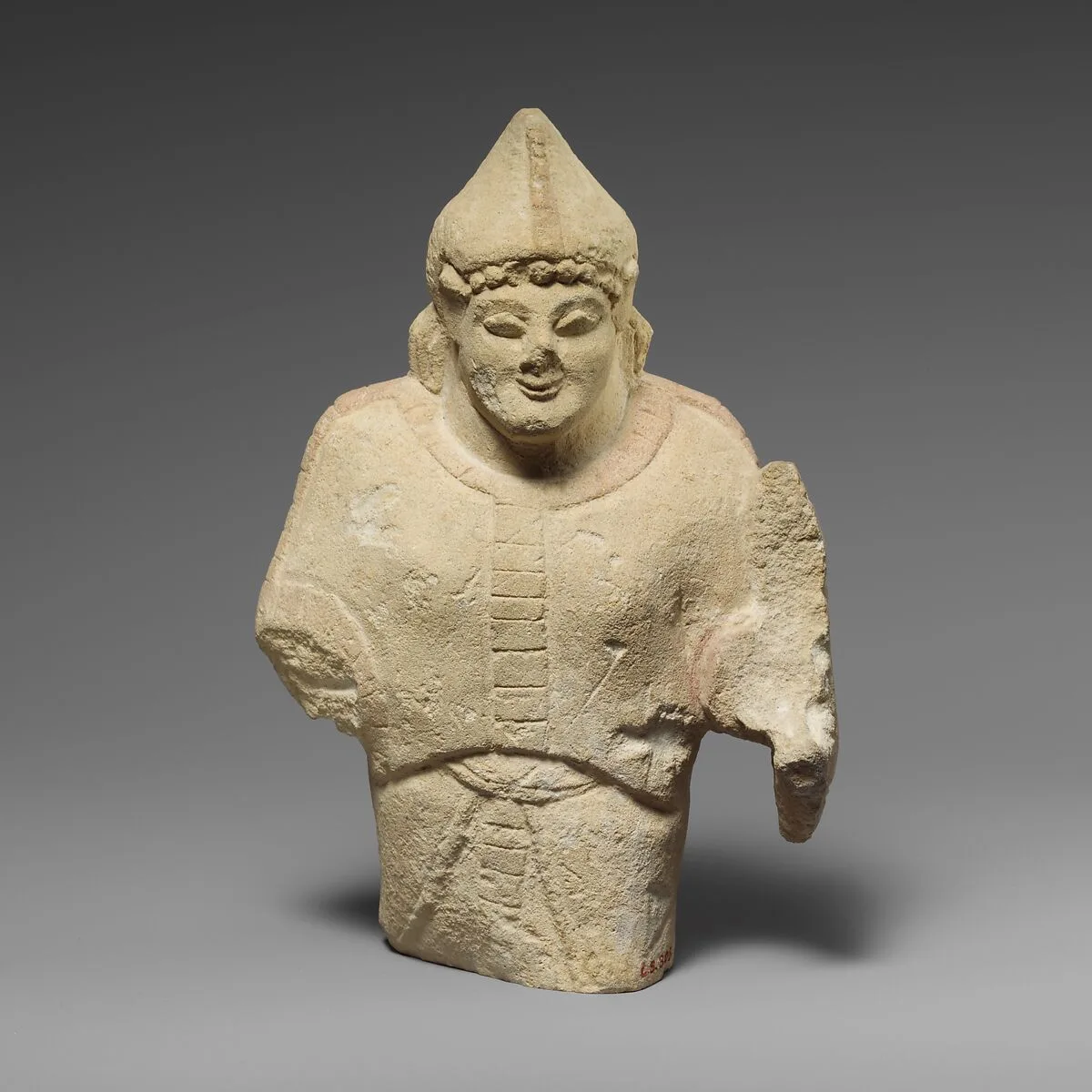 Limestone statuette of a warrior holding a shield — Unknown