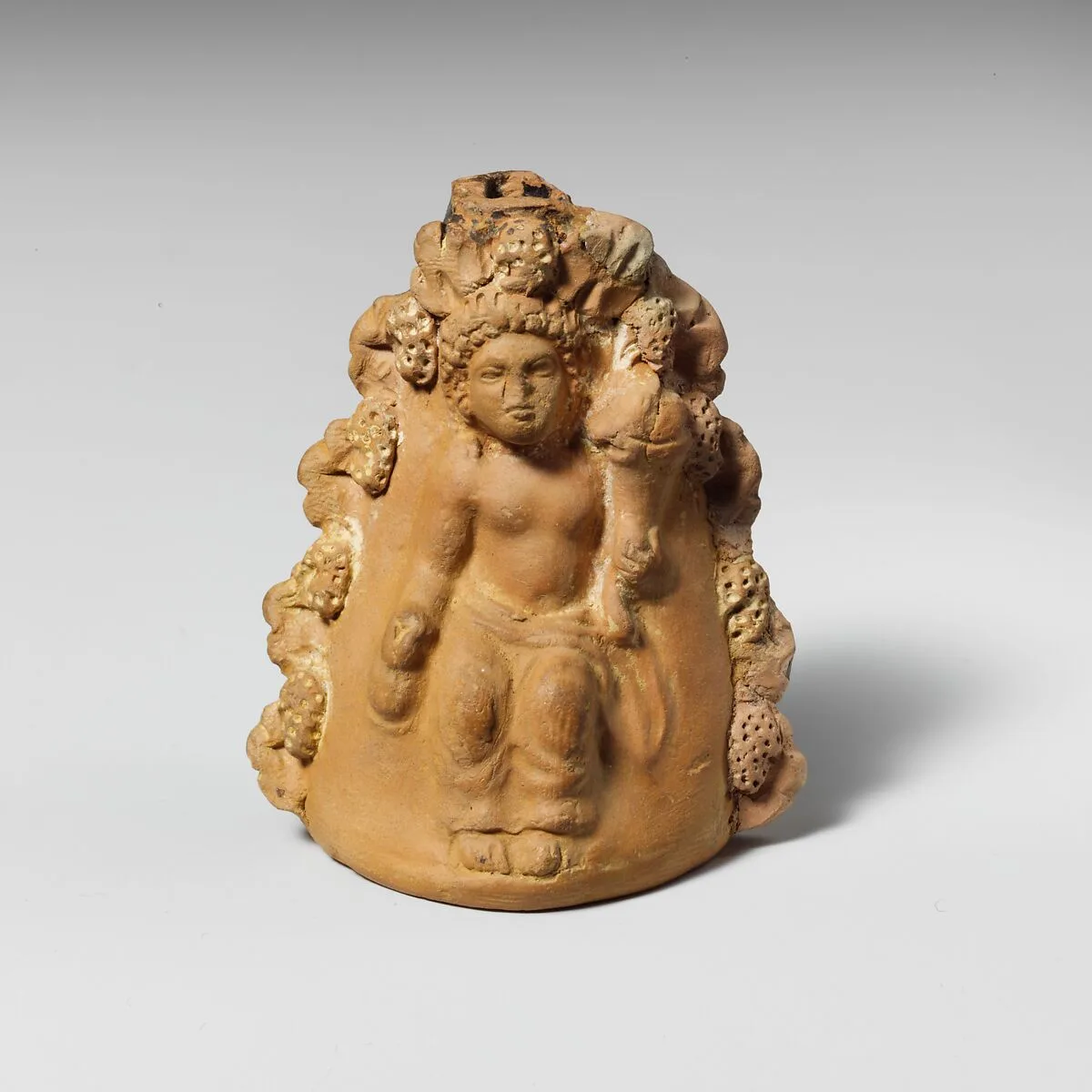 Terracotta oinochoe (jug) with a seated boy — Unknown
