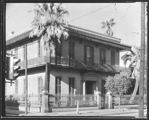 [Stone Town House with Cast-Iron Balconies and Fence in French Quarter, Esplanade Avenue, New Orleans, Louisiana]