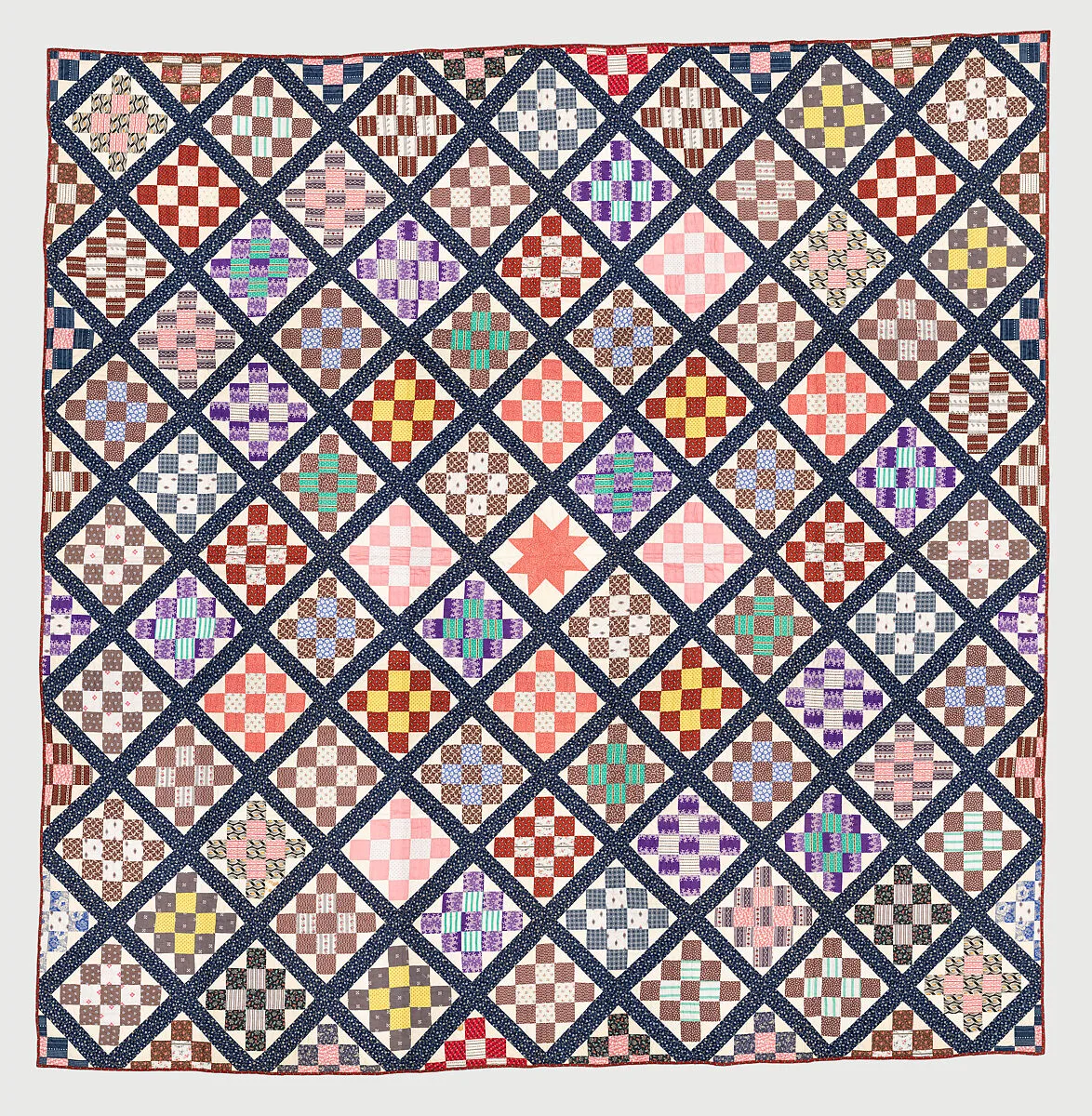 Thirteen-patch block quilt with Japanesque backing fabric — Unknown
