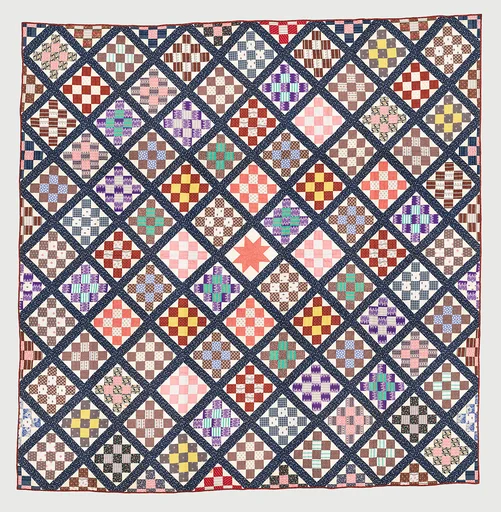 Thirteen-patch block quilt with Japanesque backing fabric