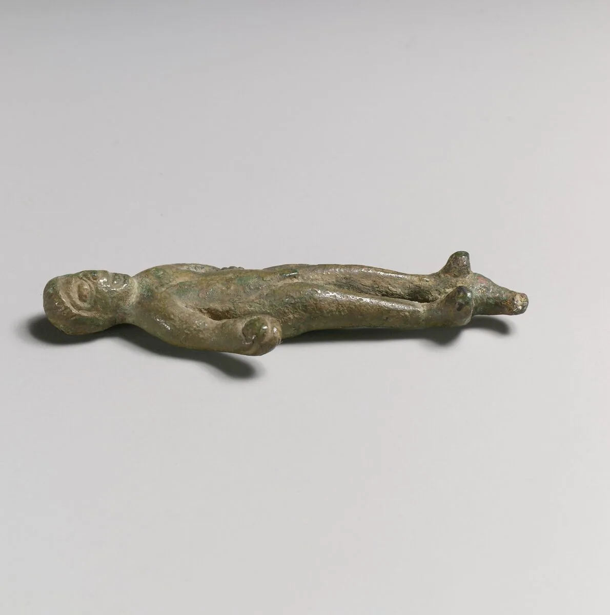Statuette of a man with object in hand — Unknown