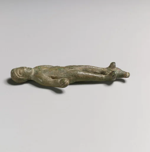 Statuette of a man with object in hand