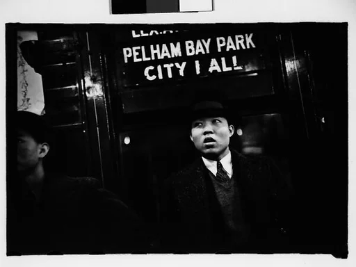 [Five 35mm Film Frames: Subway Passengers, New York City: Men Beneath "Pelham Bay Park" Sign, Couple with Child, Woman Reading Newspaper, Woman in Hat and Fur Collar Beneath "City Hall" Sign]