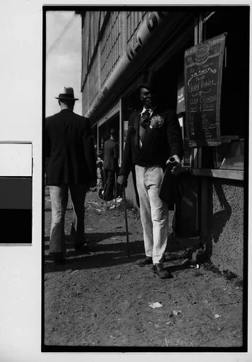 [Barker with Megaphone Outside Food Stand, New York City]