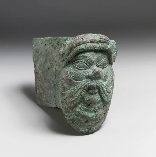 Fragment of a cart or chariot, socket with satyr mask