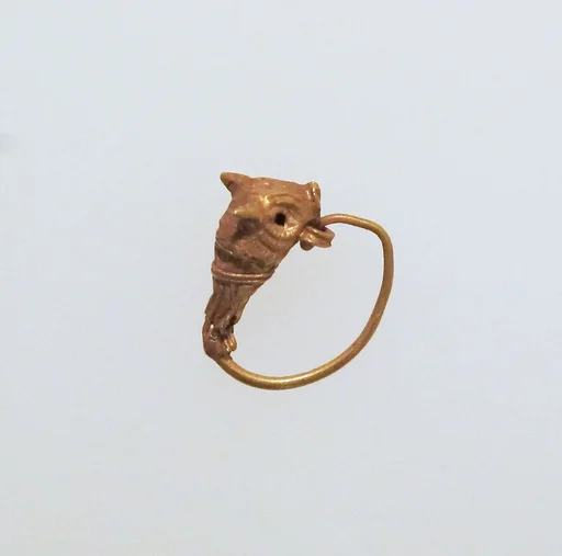 Gold earring with head of a bull