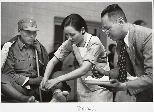 Mme. Chaing Kai-shek caring for the wounded. Hankow