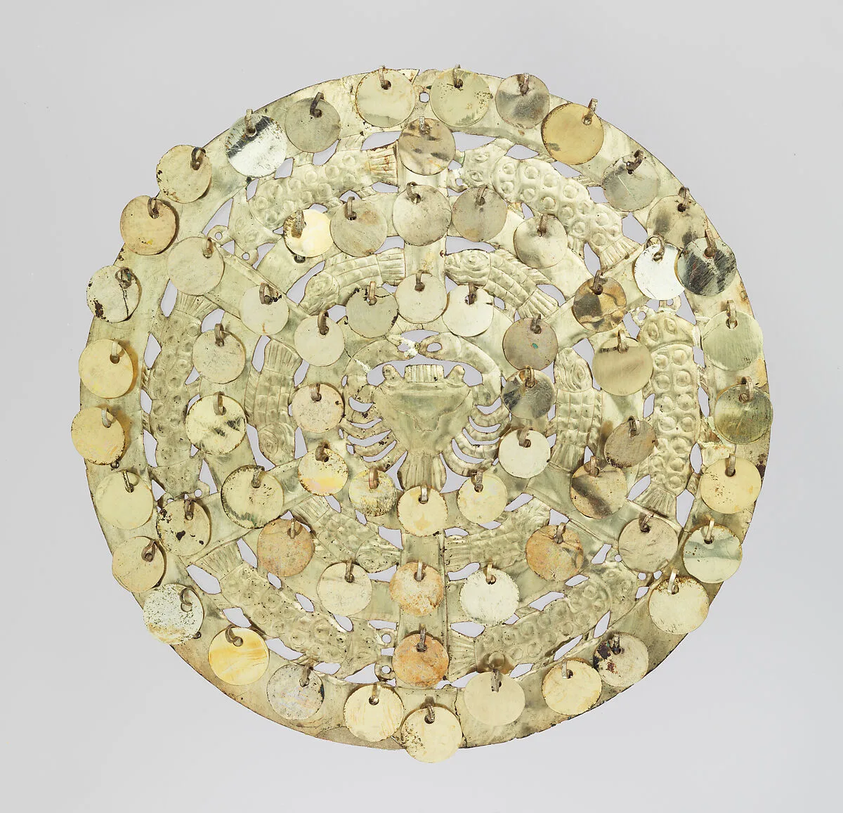 Shield with crab and fish figures — Moche artist(s)
