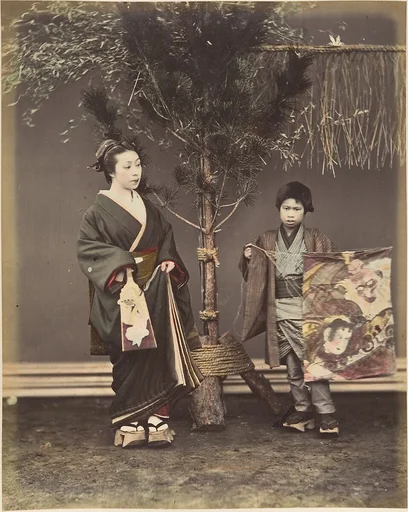 [A Japanese Woman and a Japanese Boy in Traditional Dress]
