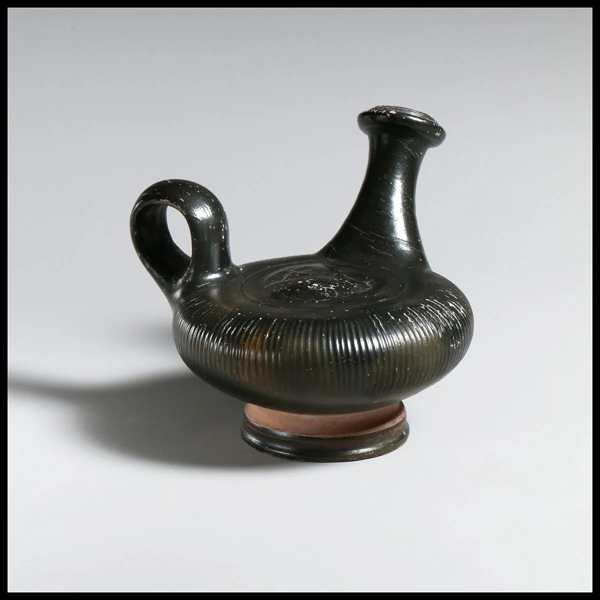 Terracotta guttus (flask with handle and vertical spout) — Unknown