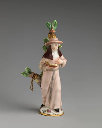 Scent bottle in the form of a nun reading a book